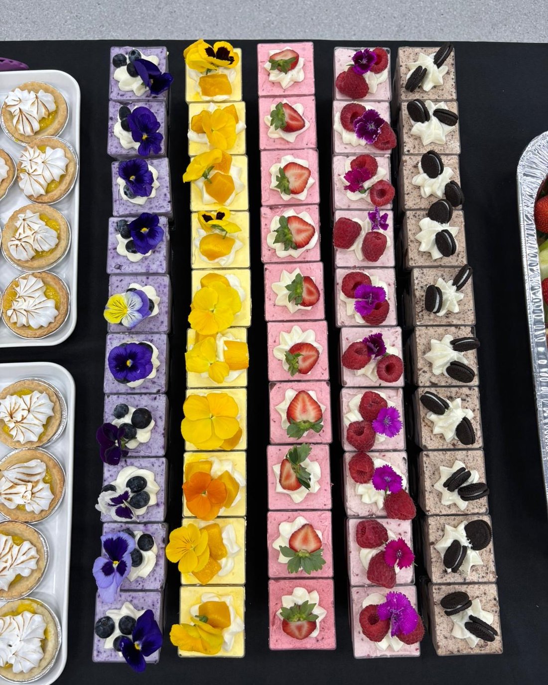 Overhead view of mousse dessert cups in five flavours