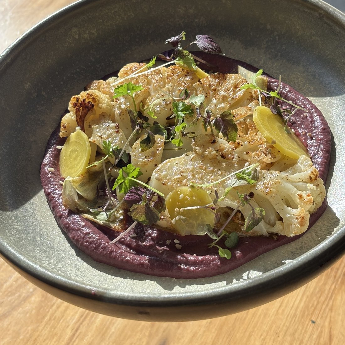 Roasted cauliflower on beetroot puree with micro herbs