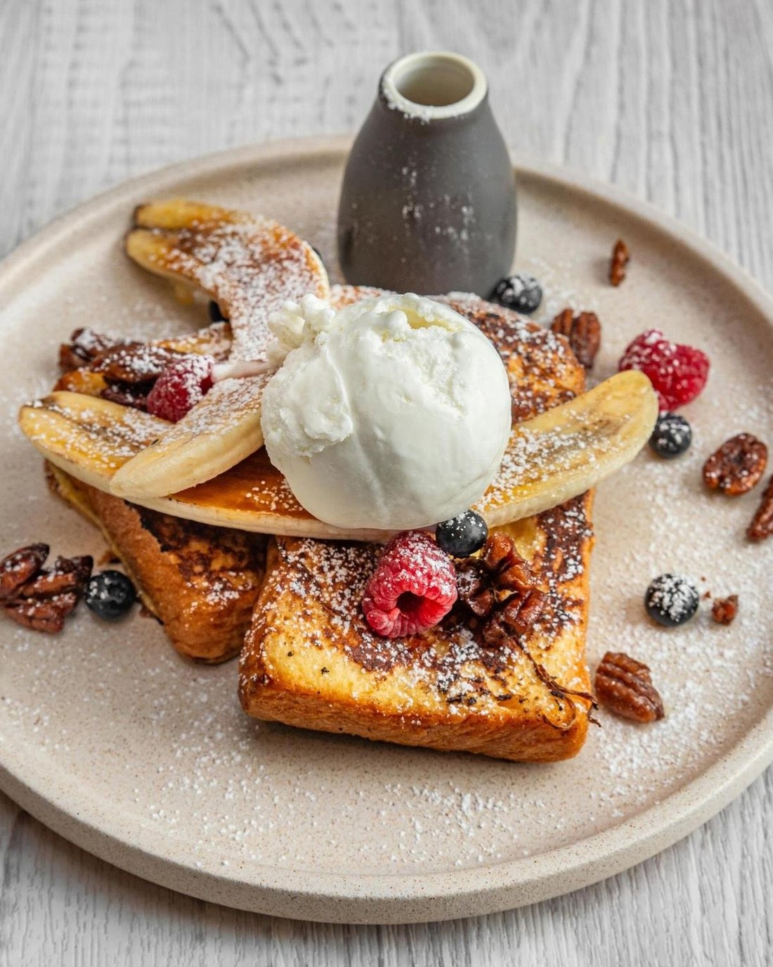 French toast with banana, berries, pecans and vanilla ice cream