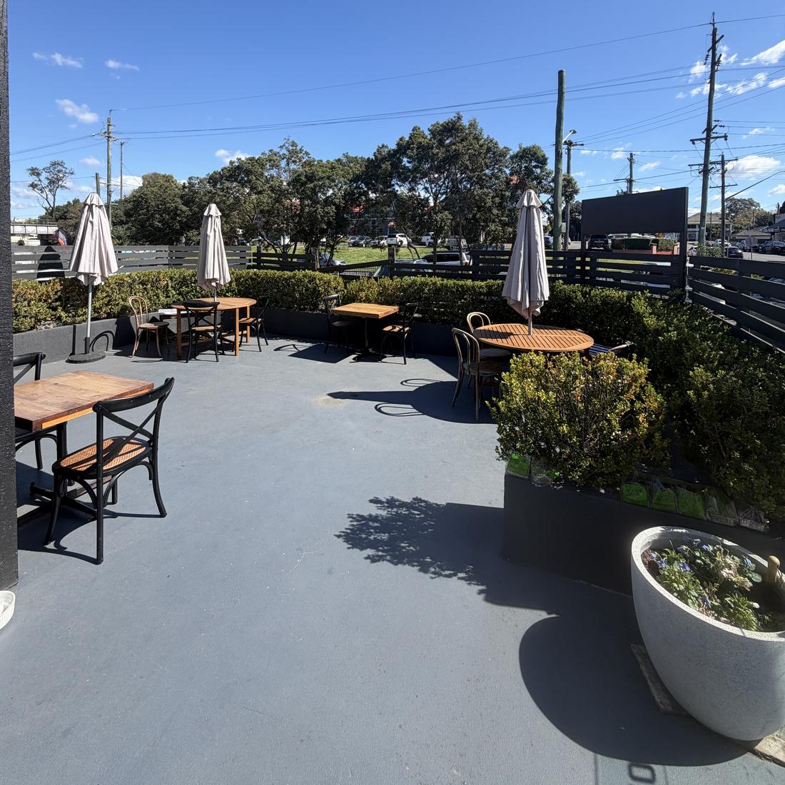 Cafe Cornerstone outdoor seating area with umbrellas